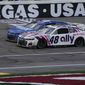 Alex Bowman (48) races beside Kyle Larson (5) during a NASCAR Cup Series auto race Sunday, March 6, 2022, in Las Vegas. (AP Photo/John Locher) **FILE**