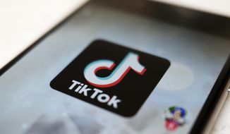 This Monday, Sept. 28, 2020, photo, shows the TikTok logo on a smartphone in Tokyo. (AP Photo/Kiichiro Sato) **FILE**
