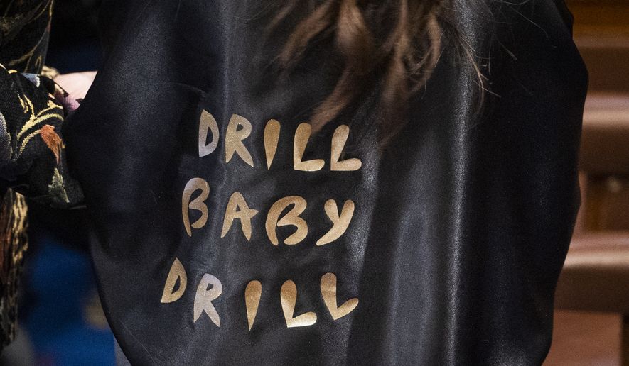Rep. Lauren Boebert, R-Colo., wears an outfit reading &quot;Drill Baby Drill&quot; as she arrives in the chamber of the House of Representatives before the State of the Union address by President Joe Biden on March 1, 2022, in Washington. (Saul Loeb/Pool via AP)