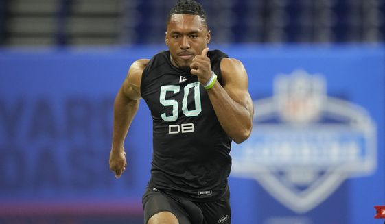 Maryland defensive back Nick Cross runs the 40-yard dash at the NFL football scouting combine, Sunday, March 6, 2022, in Indianapolis. (AP Photo/Charlie Neibergall)
