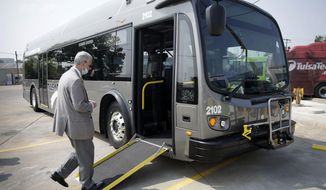 Tulsa Transit General Manager Ted Rieck boards a new electric bus on Aug. 3, 2021, in Tulsa, Okla. Tulsa Transit has 4 new electric buses in their fleet. Public transit systems straining to win back riders after crushing waves of the COVID-19 pandemic are getting a $3 billion boost to stay afloat and invest in electric buses. It&#39;s part of several initiatives being announced by the Biden administration March 7, 2022, to promote green-friendly mass transit as workers begin returning to offices (Mike Simons/Tulsa World via AP, File)