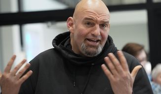 In this photo made on Friday, March 4, 2022, Pennsylvania Lt. Gov. John Fetterman visits with people attending a Democratic Party event for candidates to meet and collect signatures for ballot petitions for the upcoming Pennsylvania primary election, at the Steamfitters Technology Center in Harmony, Pa. Fetterman is running for the party nomination for the U.S. Senate. The irreverent, blunt, 6 feet 8, tattooed Fetterman faces the Pennsylvania&#39;s Democratic Party committee-backed U.S. Rep. Conor Lamb and Malcolm Kenyatta, a second-term state representative from Philadelphia. (AP Photo/Keith Srakocic) **FILE**