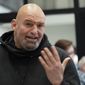 In this photo made on Friday, March 4, 2022, Pennsylvania Lt. Gov. John Fetterman visits with people attending a Democratic Party event for candidates to meet and collect signatures for ballot petitions for the upcoming Pennsylvania primary election, at the Steamfitters Technology Center in Harmony, Pa. Fetterman is running for the party nomination for the U.S. Senate. The irreverent, blunt, 6 feet 8, tattooed Fetterman faces the Pennsylvania&#39;s Democratic Party committee-backed U.S. Rep. Conor Lamb and Malcolm Kenyatta, a second-term state representative from Philadelphia. (AP Photo/Keith Srakocic) **FILE**