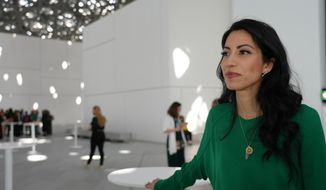 Huma Abedin poses for a picture at the Forbes 30/50 event in the Louvre Museum in Abu Dhabi, Monday, March 7, 2022. Abedin is telling her story in a 500-page memoir titled: “Both/And: A Life in Many Worlds” that she brought to the capital of the United Arab Emirates. For more than two decades, Abedin has been the ever-loyal aide to Hillary Clinton and the betrayed wife of of Anthony Weiner. She appears comfortable now stepping out into the spotlight, even if it means confronting the judgement and shame she’s faced over her marriage to former New York Congressman Anthony Weiner, whose confiscated laptop roiled Clinton’s 2016 presidential campaign. (AP Photo/Malak Harb)