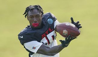 FILE - Atlanta Falcons wide receiver Calvin Ridley (18) makes a catch during the team&#39;s NFL training camp football practice Monday, Aug. 9, 2021, in Flowery Branch, Ga. Falcons wide receiver Calvin Ridley has been suspended for the 2022 season for betting on NFL games in the 2021 season. The suspension announced by NFL commissioner Roger Goodell on Monday, March 7, 2022, is for activity that took place while Ridley was away from the team while addressing mental health concerns.(AP Photo/John Bazemore, File)