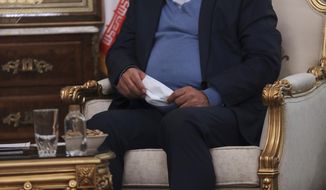 Secretary of Iran&#39;s Supreme National Security Council Ali Shamkhani sits in a meeting in Tehran, Iran on June, 12, 2021. Shamkhani said Monday, March 7, 2022, that his country is seeking &amp;quot;creative ways&amp;quot; to restore its nuclear deal with world powers after Russia&#39;s foreign minister linked sanctions on Moscow over its war on Ukraine to the ongoing negotiations. (AP Photo/Vahid Salemi)