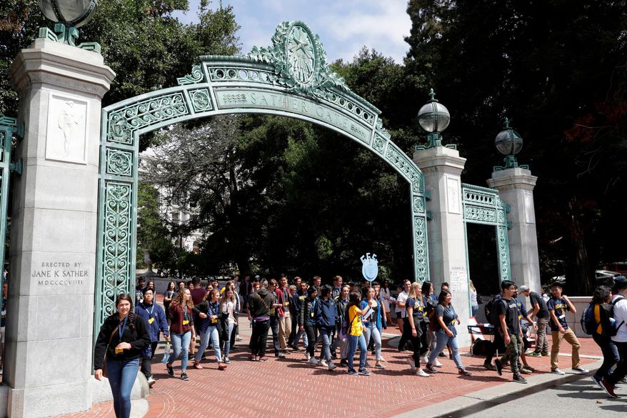 Students walk on the University of California, Berkeley campus in Berkeley, Calif., on Aug. 15, 2017. A group of residents that successfully challenged the university to limit its undergraduate enrollment offered to allow 1,000 more students in the upcoming academic year. Save Berkeley Neighborhoods said Saturday, March 5, 2022, it&#39;s willing to settle a lawsuit with the prestigious public university if UC Berkeley ends its effort to get out from this week&#39;s court order to cap enrollment to the 2020-21 school year level. (AP Photo/Marcio Jose Sanchez, File)