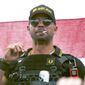 In this Sept. 26, 2020, file photo, Proud Boys leader Henry &quot;Enrique&quot; Tarrio wears a hat that says The War Boys during a rally in Portland, Ore.  The leader of the far-right Proud Boys extremist group, Tarrio, was arrested Tuesday on a conspiracy charge for his suspected role in a coordinated attack on the U.S. Capitol to stop Congress from certifying President Joe Biden’s 2020 electoral victory. (AP Photo/Allison Dinner, File)