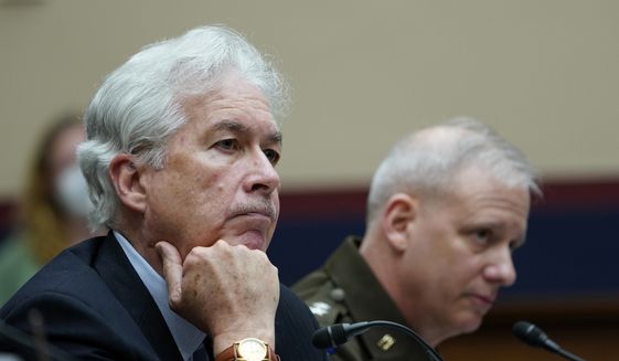 Central Intelligence Agency Director William Burns, left, and Defense Intelligence Agency Director Lt. Gen. Scott Berrier, right, listen on Capitol Hill in Washington, Tuesday, March 8, 2022, as they testify before a House Permanent Select Committee on Intelligence hearing on worldwide threats. (AP Photo/Susan Walsh)