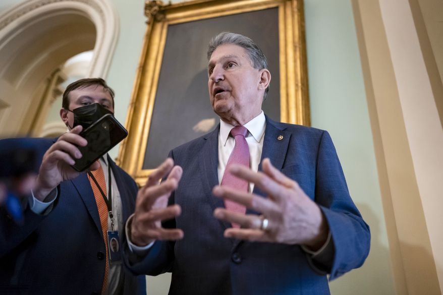 Sen. Joe Manchin, D-W.Va., chairman of the Senate Energy and Natural Resources Committee, stops to speak to reporters as he arrives for a lunch meeting with fellow Democrats, at the Capitol in Washington, Tuesday, March 8, 2022. (AP Photo/J. Scott Applewhite) **FILE**