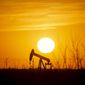 A pump jack operates as the sun begins to set on the western horizon Monday, March 7, 2022, near Pleasant Farms, an unincorporated community in southeastern Ector County, Texas. Oil prices are rising sharply again Tuesday as the U.S. prepares to ban crude oil imports from Russia in response to that country&#x27;s unprovoked invasion of neighboring Ukraine. (Jacob Ford/Odessa American via AP)