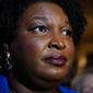 Georgia gubernatorial Democratic candidate Stacey Abrams talks to the media after qualifying for the 2022 election on Tuesday, March 8, 2022, in Atlanta. Abrams has no announced opposition for governor for the Democratic nomination. (AP Photo/Brynn Anderson)