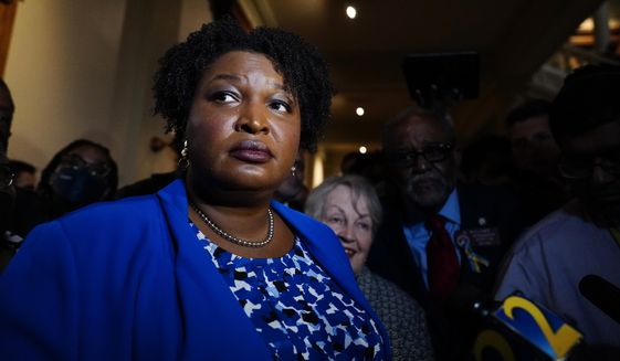 Georgia gubernatorial Democratic candidate Stacey Abrams talks to the media after qualifying for the 2022 election on Tuesday, March 8, 2022, in Atlanta. Abrams has no announced opposition for governor for the Democratic nomination. (AP Photo/Brynn Anderson)