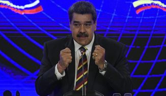 Venezuela&#39;s President Nicolas Maduro speaks after the signing of an accord with Russia, at the Presidential Palace in Caracas, Venezuela, Wednesday, Feb. 16, 2022. Venezuelan and Russian officials met for high-level discussions in the South American country, a day after diplomats from the U.S. and several other nations gathered to discuss steps toward a negotiated solution to the country&#39;s protracted crisis. (AP Photo/Matias Delacroix)