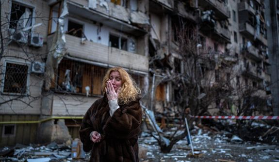 A woman cries following a rocket attack on Kyiv, Ukraine. Russian President Vladimir Putin has waged a war against neo-Nazism in Ukraine. (Associated PRess)