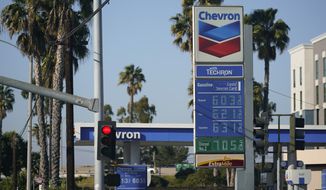 Gas prices are displayed at a gas station in Long Beach, Calif., Wednesday, March 9, 2022. (AP Photo/Ashley Landis) ** FILE **