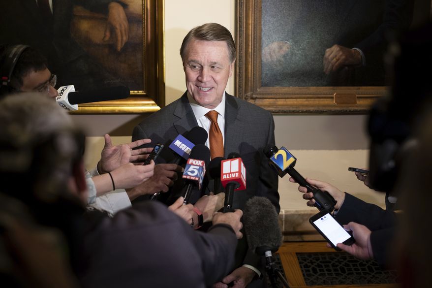 Former U.S. Sen. David Perdue speaks to journalists after filing paperwork to qualify to run for governor Wednesday, March 9, 2022 at the Georgia State Capitol in Atlanta.  (Ben Gray/Atlanta Journal-Constitution via AP)