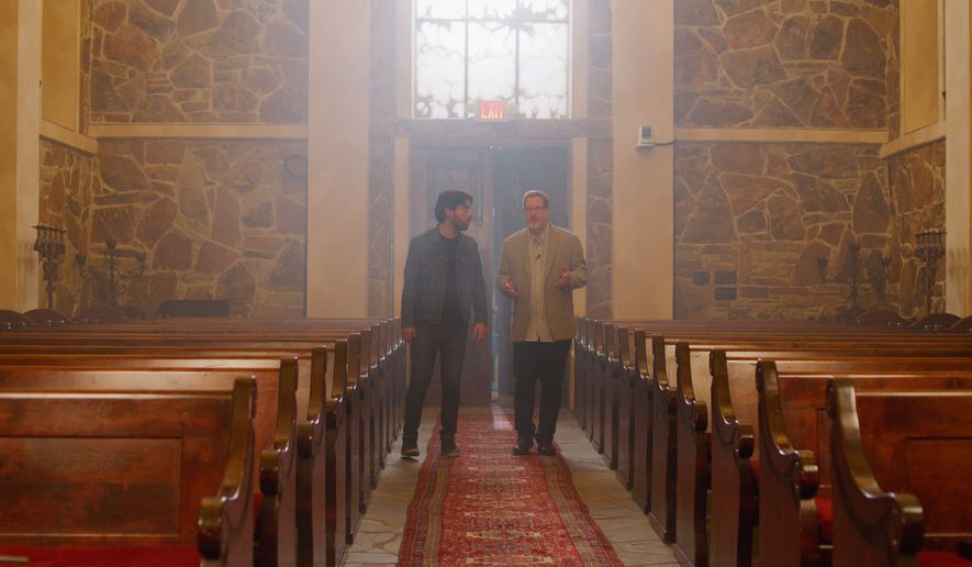Documentary director Mani Sandoval and author Lee Strobel talk in a church location where part of “The Case for Heaven,” based on Mr. Strobel’s 2021 book, was filmed. (Courtesy photo)