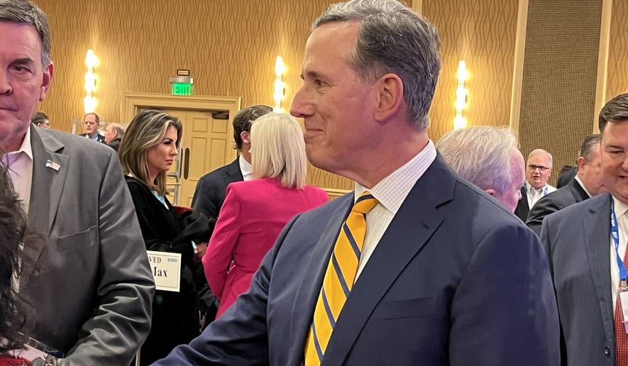 Former Senator Rick Santorum, Pennsylvania Republican, greets members of the National Religious Broadcasters following a speech at the evangelical group&#39;s media leadership dinner on March 9, 2022, in Nashville, Tennessee. (Mark A. Kellner/The Washington Times)