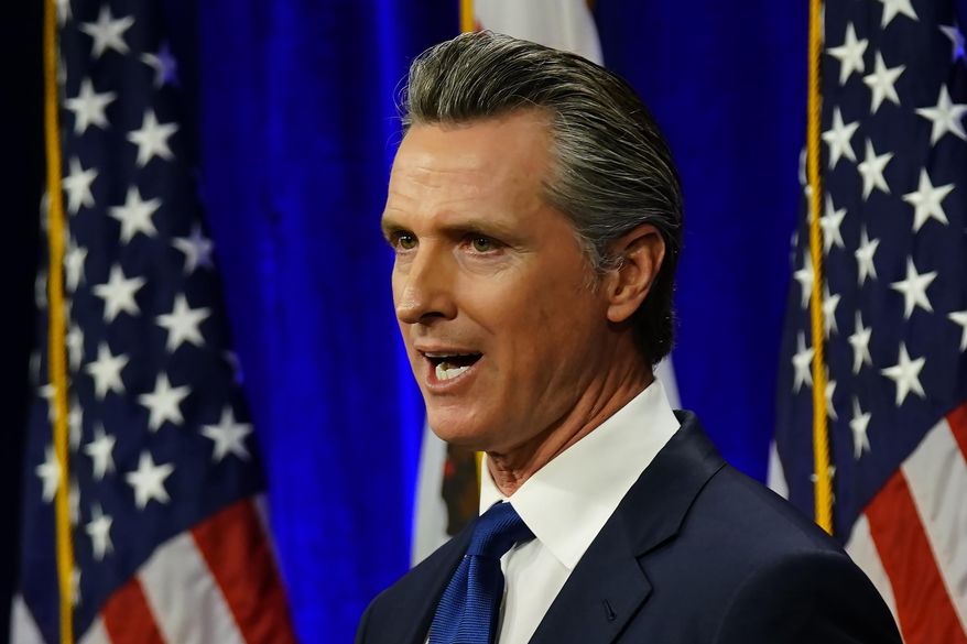 In this file photo, California Gov. Gavin Newsom delivers his annual State of the State address in Sacramento, Calif., Tuesday, March 8, 2022. Mr. Newsom has called for a gas tax rebate to lessen pain at the pump for Golden State motorists. (AP Photo/Rich Pedroncelli)  **FILE**