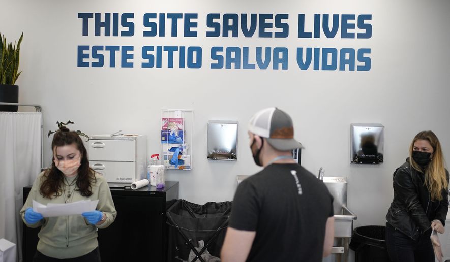 A sign on the wall reads &amp;quot;This site save lives&amp;quot; in Spanish and English at an overdose prevention center at OnPoint NYC in New York, N.Y., Friday, Feb. 18, 2022. Equipped and staffed to reverse overdoses, New York City’s new, privately run centers are a bold and contested response to a storm tide of opioid overdose deaths nationwide. (AP Photo/Seth Wenig)