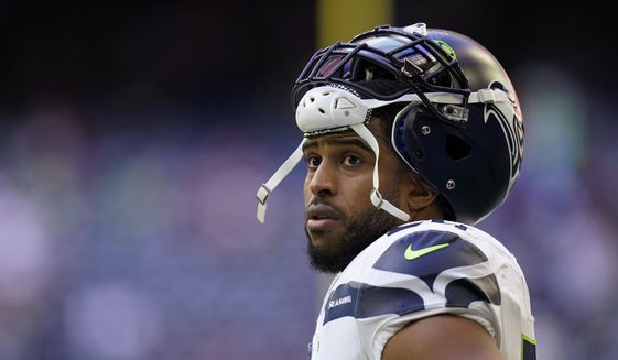 Seattle Seahawks linebacker Bobby Wagner pauses during the team&#39;s NFL football game against the Houston Texans on Dec. 12, 2021, in Houston. Wagner has been informed he is being released by Seattle. Wagner confirmed the news to The Associated Press on Tuesday night, March 8, 2022, hours after the team agreed to trade quarterback Russell Wilson to Denver. Seattle is expected to make Wagner&#39;s release official Wednesday. (AP Photo/Matt Patterson, File) **FILE**