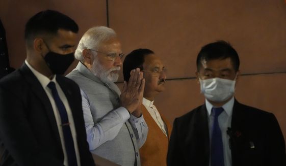 Indian Prime Minister Narendra Modi, second left, and Bharatiya Janata Party President J.P. Nadda arrive at the party headquarters in New Delhi, India, Thursday, March 10, 2022. Modi&#39;s Hindu nationalist party has a commanding lead in crucial state polls, despite his government&#39;s criticized handling of COVID-19, soaring unemployment and farmer protests. (AP Photo/Manish Swarup)