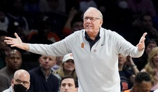 Syracuse head coach Jim Boeheim works the bench in the first half of an NCAA college basketball game against Duke during quarterfinals of the Atlantic Coast Conference men&#x27;s tournament, Thursday, March 10, 2022, in New York. (AP Photo/John Minchillo)