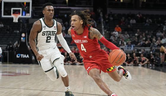 Maryland&#39;s Fatts Russell (4) goes to the basket against Michigan State&#39;s Tyson Walker (2) during the first half of an NCAA college basketball game at the Big Ten Conference tournament, Thursday, March 10, 2022, in Indianapolis. (AP Photo/Darron Cummings)