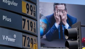 Gas prices are seen in front of a billboard advertising HBO&#39;s Last Week Tonight in Los Angeles, March 7, 2022.  (AP Photo/Jae C. Hong, File)  **FILE**