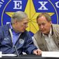 Texas Gov. Greg Abbott, left, and Texas Attorney General Ken Paxton confer during a conference after an Operation Lone Star roundtable discussion at the Texas Department of Public Safety Weslaco Regional Office on Thursday, March 10, 2022, in Weslaco, Texas. (Joel Martinez/The Monitor via AP) ** FILE **