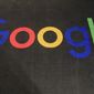 The logo of Google is displayed on a carpet at the entrance hall of Google France in Paris, Monday, Nov. 18, 2019. The European Union threatened to crack down on an agreement between Google and Facebook parent Meta for online display advertising services, saying Friday, March 11, 2022, that the deal may breach the bloc’s rules on fair competition.(AP Photo/Michel Euler, File)