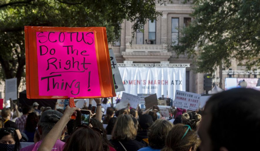 People attend the Women&#39;s March ATX rally on Oct., 2, 2021, at the Texas State Capitol in Austin. The Texas Supreme Court on Friday paved the way for the nation&#39;s toughest abortion law to remain in place in a ruling that again deflated clinics&#39; hopes of stopping — or even pausing — the restrictions any time soon. (AP Photo/Stephen Spillman) **FILE**