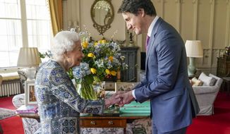 Britain&#39;s Queen Elizabeth II receives Canada&#39;s Prime Minister Justin Trudeau during an audience at Windsor Castle, Windsor, England, Monday March 7, 2022. (Steve Parsons/Pool via AP)