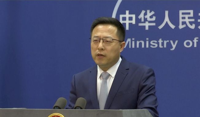 In an image taken from video, Chinese Foreign Ministry spokesperson Zhao Lijian speaks during a media briefing Thursday, March 10, 2022, in Beijing. China on Thursday said the international community was &amp;quot;highly concerned&amp;quot; about what it alleged was biological military activities by the U.S., echoing its warring ally&#x27;s claim of Washington&#x27;s illegal chemical weapons development in Ukraine. (AP Photo)