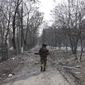 A Ukrainian serviceman walks near the position he was guarding in Mariupol, Ukraine, Saturday, March 12, 2022. Ukraine’s military says Russian forces have captured the eastern outskirts of the besieged city of Mariupol. In a Facebook update Saturday, the military said the capture of Mariupol and Severodonetsk in the east were a priority for Russian forces. Mariupol has been under siege for over a week, with no electricity, gas or water.(AP Photo/Evgeniy Maloletka)