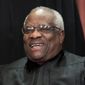 In this Nov. 30, 2018, photo, Supreme Court Associate Justice Clarence Thomas sits for a group portrait at the Supreme Court Building in Washington. (AP Photo/J. Scott Applewhite, File)