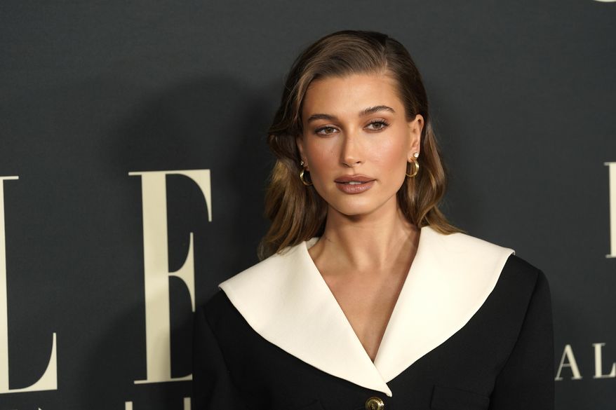 Hailey Bieber arrives at the 27th annual ELLE Women in Hollywood celebration on Tuesday, Oct. 19, 2021, at the Academy Museum of Motion Pictures in Los Angeles. The model says on Saturday, March 12, 2022, that she&#x27;s fine after a health scare, suffering a small blood clot to her brain. Bieber, wife of pop star Justin Bieber, posted on Instagram Saturday that she was having breakfast with her husband on Thursday when she began feeling stroke-like symptoms. (AP Photo/Chris Pizzello, File)