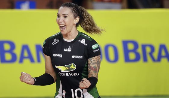 Bauru&#x27;s volleyball player Tiffany Abreu celebrates a point during a Brazilian volleyball league match in Bauru, Brazil, Tuesday, Dec. 19, 2017. Tiffany Abreu is Brazil&#x27;s first transgender person to play in the top volleyball league for women. (AP Photo/Andre Penner)