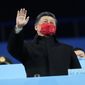 Chines President Xi Jinping waves during the closing ceremony at the 2022 Winter Paralympics, Sunday, March 13, 2022, in Beijing. (AP Photo/Shuji Kajiyama)