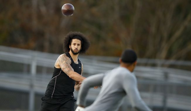 Free agent quarterback Colin Kaepernick participates in a workout for NFL football scouts and media, Saturday, Nov. 16, 2019, in Riverdale, Ga. In a tweet Sunday, March 13, 2022, Kaepernick indicated that he is seeking receivers to catch his passes and a team to sign him. (AP Photo/Todd Kirkland, File) **FILE**
