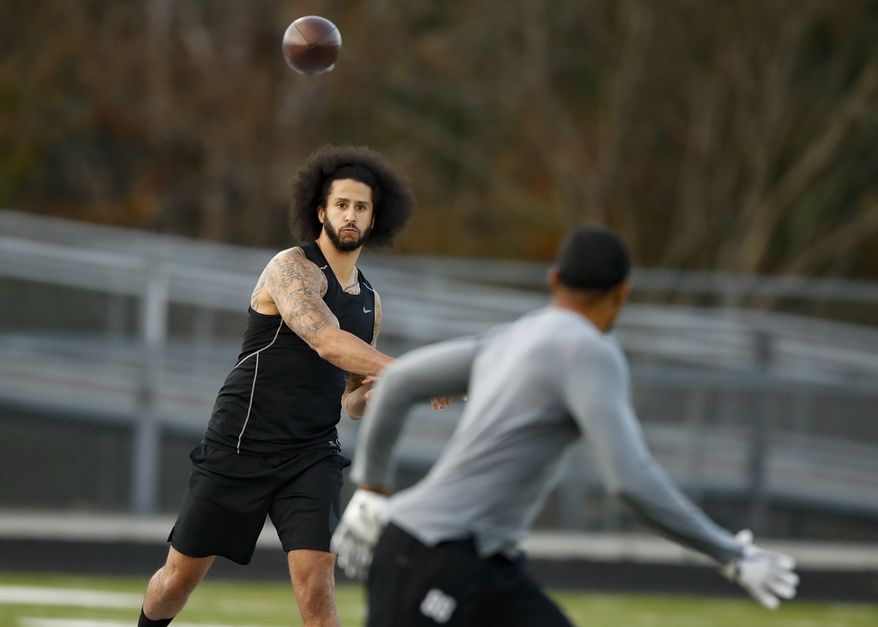 Free agent quarterback Colin Kaepernick participates in a workout for NFL football scouts and media, Saturday, Nov. 16, 2019, in Riverdale, Ga. In a tweet Sunday, March 13, 2022, Kaepernick indicated that he is seeking receivers to catch his passes and a team to sign him. (AP Photo/Todd Kirkland, File) **FILE**