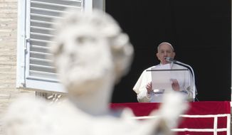 Pope Francis reads his message during the Angelus noon prayer from the window of his studio overlooking St.Peter&#39;s Square, at the Vatican, Sunday, March 13, 2022. (AP Photo/Gregorio Borgia)
