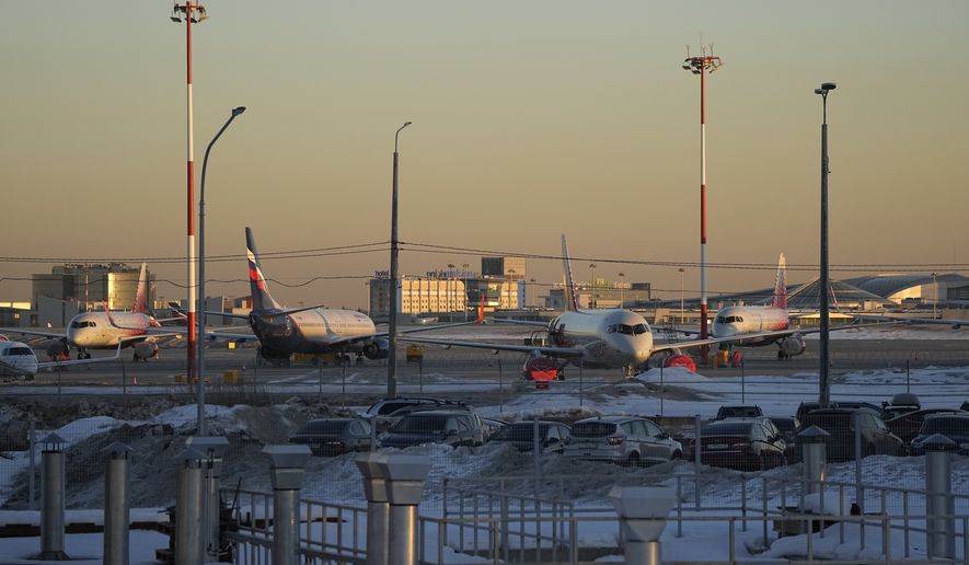 Passenger planes are parked at Sheremetyevo airport, outside Moscow, Russia, March 1, 2022. The fate of hundreds of planes leased by Russian airlines from foreign companies grew murkier Monday, March 14, 2022 after Russian President Vladimir Putin signed a law letting the airlines register those planes and continue flying them. (AP Photo/Pavel Golovkin, file)