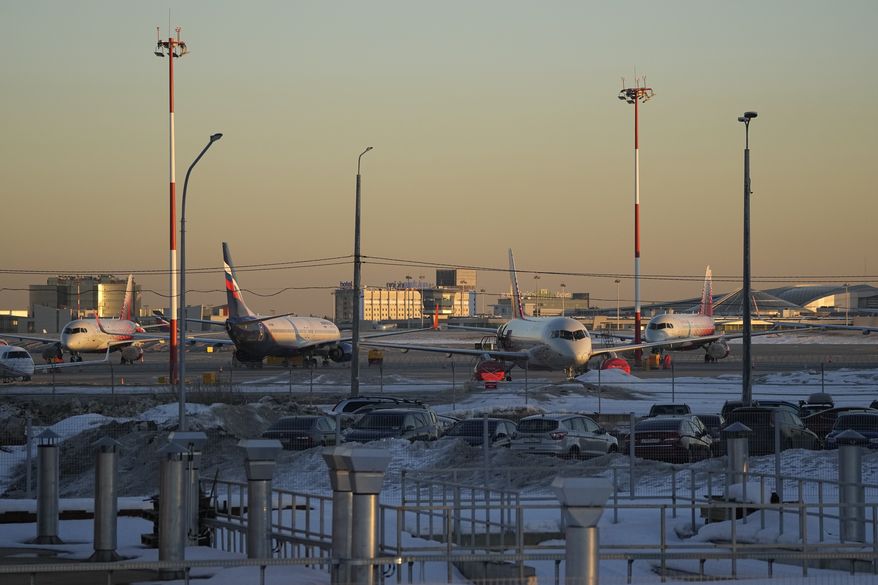 Passenger planes are parked at Sheremetyevo airport, outside Moscow, Russia, March 1, 2022. The fate of hundreds of planes leased by Russian airlines from foreign companies grew murkier Monday, March 14, 2022 after Russian President Vladimir Putin signed a law letting the airlines register those planes and continue flying them. (AP Photo/Pavel Golovkin, file)