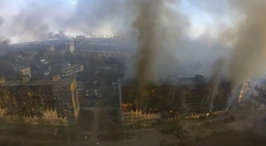 This image taken from video provided by Azov Battalion shows an aerial view of burned out high-rise buildings in Mariupol, Ukraine, Monday March 14, 2022. Mariupol, which sits on the Azov Sea, is surrounded by Russian forces and has come under heavy bombardment recently. (Azov Battalion via AP)