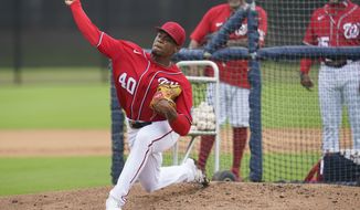 Washington Nationals&#39; Josiah Gray pitches during the team&#39;s spring training baseball workout, Tuesday, March 15, 2022, in West Palm Beach, Fla. (AP Photo/Sue Ogrocki)