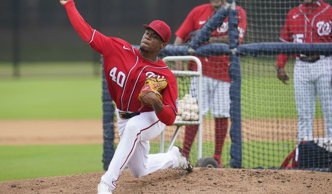 Washington Nationals&#x27; Josiah Gray pitches during the team&#x27;s spring training baseball workout, Tuesday, March 15, 2022, in West Palm Beach, Fla. (AP Photo/Sue Ogrocki)
