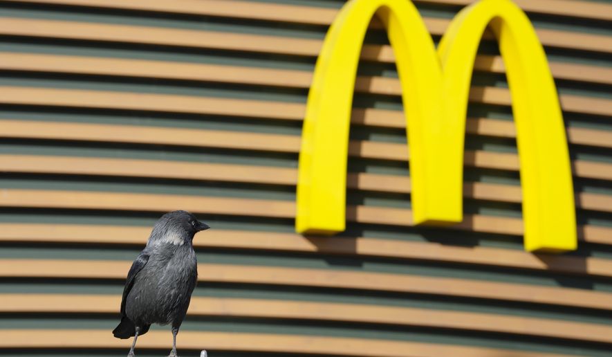 A bird sits next to a McDonald&#39;s restaurant closed to visitors in St. Petersburg, Russia, Tuesday, March 15, 2022. (AP Photo)