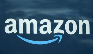 FILE - An Amazon logo appears on an Amazon delivery van, on Oct. 1, 2020, in Boston. European regulators on Tuesday cleared Amazon&#39;s purchase of Hollywood studio MGM, saying the deal doesn&#39;t raise any competition concerns. Amazon said last year it was buying MGM in a deal worth $8.45 billion that the online shopping giant said was aimed at bulking up its video streaming service with more stuff to watch. (AP Photo/Steven Senne, File)
